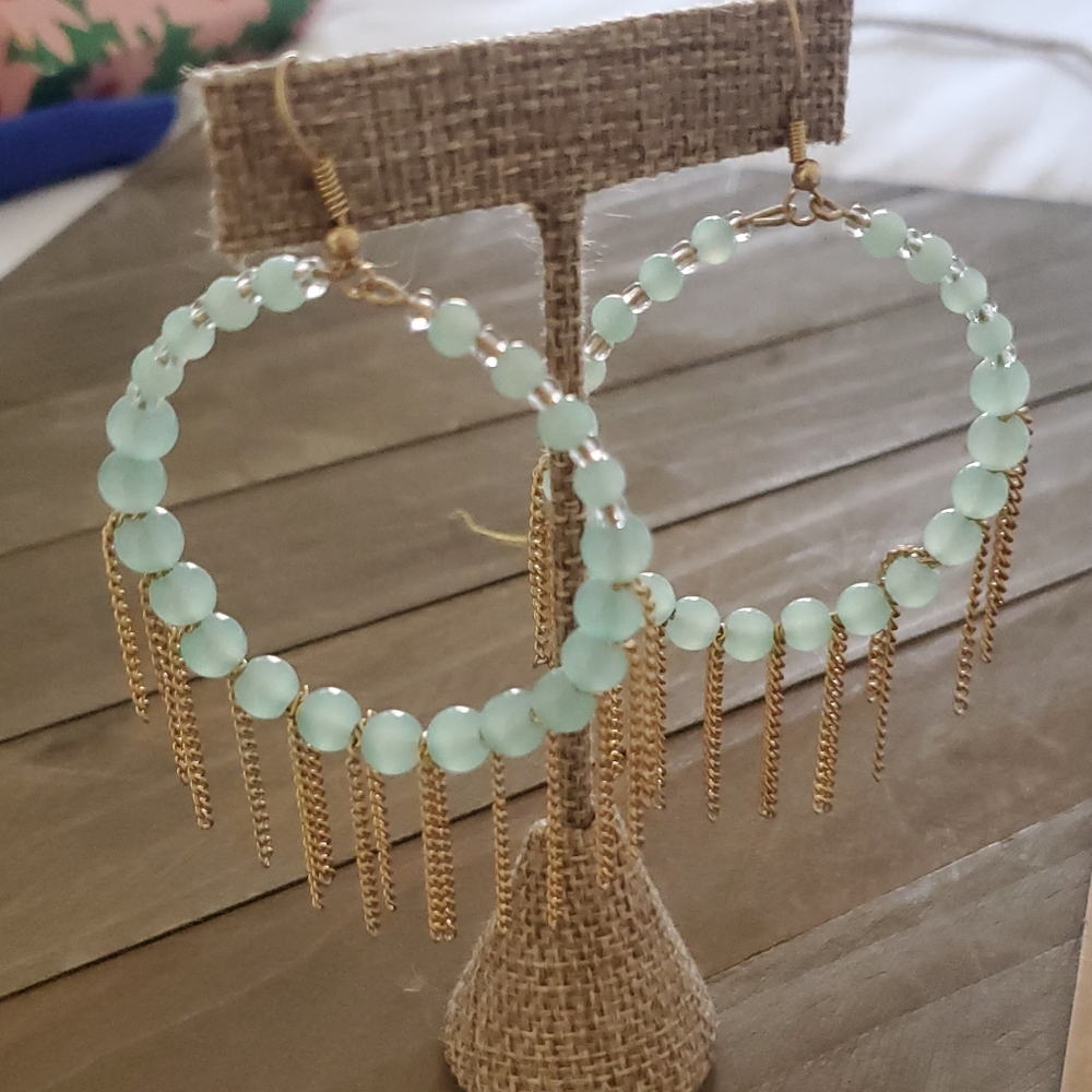 Beautiful earrings with teal color beads and gold chains